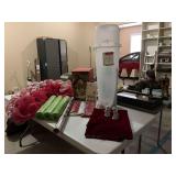 Grouping of Christmas decorations. Candy cane door hanger, gift wrap box, and other decor.