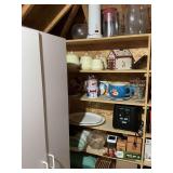Contents of items on top and in left side of shelving unit. Includes five shelves and the top portion of this unit. The yellow canister set is an antique folklore canister set.