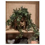 Decorative floral ivy in terra cotta pot and gold stand