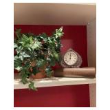 Group of three decor pieces; Ivy in a terra-cotta pot 8 1/2 inches tall, a 7 inch false book and a spade shaped Godinger Crystal Legends quartz clock