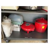 Contents of bottom shelf in garage