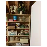 Contents of shelving unit in attic on right side; five shelves, top and in front