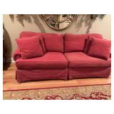 Red four cushion couch with four matching pillows. 88“ x 36“ x 36“