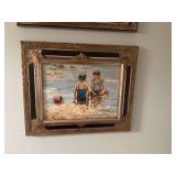 Beautifully framed black and gold oil painting of children on beach. 24” x 19 1/2”
