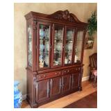 Beautifully detailed cherry breakfront china cabinet with etched glassing on two of the doors. Excellent condition. Contents not included 63” x 16” x 7’.