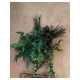 Faux greenery in gold metal wall planter. The planter is 12” x 12”, the overall floral arrangement is approximately 33” x 30”.
