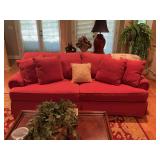 Red four cushion couch with four matching pillows. 88“ x 36“ x 36“
