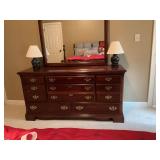 Vaughn of Virginia Cherry eight drawer dresser with mirror. Excellent condition. 62“ x 18“ x 32“ The mirror measures 47“ x 43“.