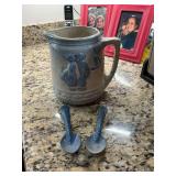 Antique blue and white salt glaze stoneware 7” pitcher, kissing Dutch couple with windmill. Does have some damage as shown- and two blue and white speckled enamel spoons.