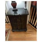 Black three drawer occasional table with gold floral design.  21 1/2” x 16” x 30” flaws as shown
