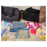 Variety of travel bags, cosmetic pouches, and travel-sized toiletry containers laid out on a carpet.