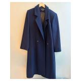 Donnybrook Navy long coat featuring a double-breasted front and wide notch lapels