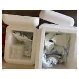 2 insulated Styrofoam shipping coolers filled with reusable gel ice packs and refrigerant bottles