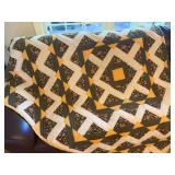 84x65” handmade patchwork quilt w/geometric medallion design with black-and-yellow floral print