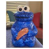 1970s Sesame Street Cookie Monster ceramic cookie jar - 12” tall - shows small chipping outside due to normal use and age - chipping around inner rim