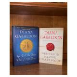 (2) Diana Gabaldon novels - First Edition hardback “Go Tell The Bees That I Am Gone” and paperback “Written In My Own Heart’s Blood”