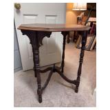 Very nice vintage wooden octagonal side table featuring gracefully turned spindle legs and a classic cross-stretcher base - label on bottom but too faded to read - 26”D x 29” tall - slight blemish