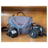 Nikon D70 6.1-megapixel digital SLR camera equipped with a black Nikkor AF-S DX 18-70mm zoom lens and a branded lens cap