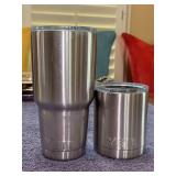 Grouping of (2) YETI cups with lids - left is collector cup