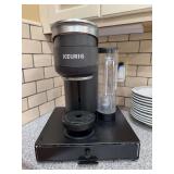 KEURIG coffee maker, stand and a few cups - working condition