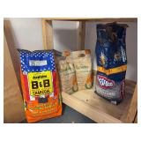 (3) new bags and (1) partial bag of charcoal