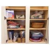 Contents of (2) laundry room cabinets - disposable plates/cups/napkins & various lightbulbs - some boxes may only be partially full