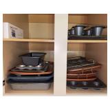 Contents of kitchen cabinet above oven - mostly bakeware