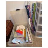 Clear tote of wrapping paper/bags/other - includes rolls that would not fit in tote
