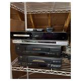 Grouping of (2) VHS players and (2) DVD players - none are tested and there are 3 remotes