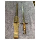 Possibly Italian M1891 Carcano bayonet with wooden grips and a metal crossguard - only marking is A2923 on crossguard