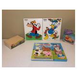 Grouping of puzzles - boxed set of 4-in-1, wood Goofy, wood Donald Duck, Winnie the Pooh and a Mix and Match 3D Animal Farm Book with interchangeable wooden pieces