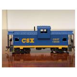 CSX blue and yellow wide-vision caboose (exact gauge unknown but would better HO or N)