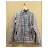 Men’s Gray Patagonia Nano Puff Jacket featuring a quilted brick pattern and bright blue zipper accents - size L