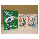 (3) Dr. Seuss hardback books - all are in used condition with spine damage