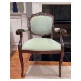 Traditional walnut carved wood accent mahogany armchair with padded armrests, and a light green textured dot-pattern upholstered oval back and seat - 23 x 18-1/2 x 17-1/2 tall to seat (36 tall overall