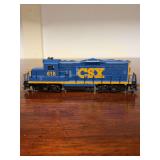 HO Scale Walthers Trainline EMD GP15-1 diesel locomotive in the CSX Transportation YN3 paint scheme (blue and yellow) bearing road number 618