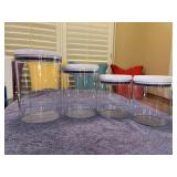 4-piece set of OXO Good Grips POP Canisters featuring a clear square plastic body and a white push-button airtight lid