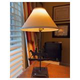 Black metal base lamp with Indian silhouette design - 23” tall