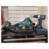 Grouping of Makita 18V battery powered tools - all share the same size battery (2 are included), 1 charger (working condition) and a box of bits - all tools are functional