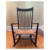 Vintage solid wood rocking chair with spindle back and rush seating - 25 x 18-1/2 x 16-1/2 tall to seat (41-1/2 tall overall) - has blemishes from normal use and seat is stained on one side