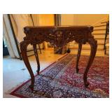Beautiful carved wood side table featuring cabriole legs and an ornate carved face motif on the apron, consistent with a late 19th- or early 20th-century French Louis XV revival style piece