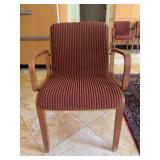 Vintage Bill Stephens 1300 Series armchair featuring a warm wooden frame and red-and-black striped upholstery - scuffing along bottom of legs from normal use