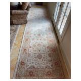 Very nice traditional Oushak-style hallway runner rug featuring soft cream and beige tones adorned with muted red and green floral motifs - 48 x 173