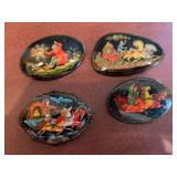 Set of four Russian hand-painted lacquer pins. Three are artist signed.