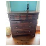 Antique Burlwood Empire style dresser with four drawers. The second drawer does not close all the way. 42 1/2” x 21 1/2”