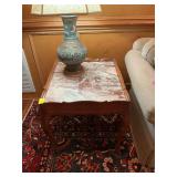 Marble top table in Browns and creams. 25” x 28 1/2” x 24”