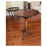 Antique three legged wooden table.  21 inches round by 27 inches tall