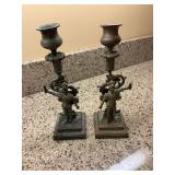 A pair of 9 inch antique brass medieval knight candlestick holders