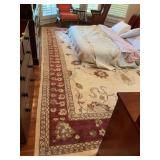Oriental rug 130“ x 182“ in rust and cream. Could not move matress to get complete picture