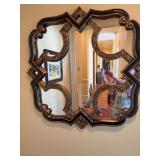 Unique black and gold resin mirror with a few chips as shown. This is 36 in.²